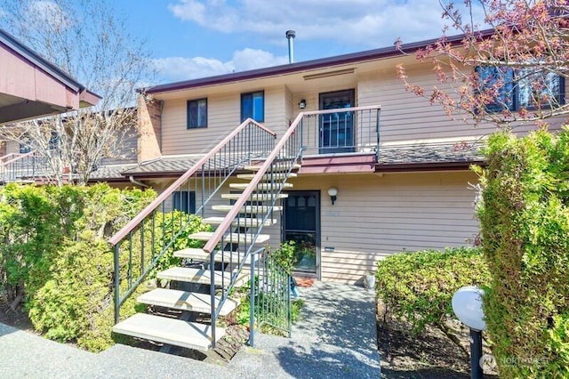 view of front of property with stairway