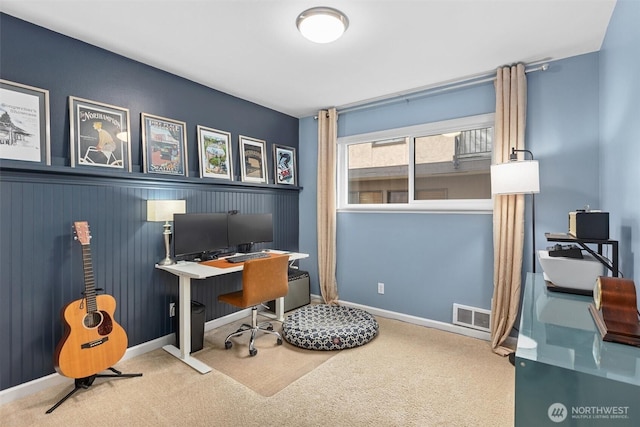 office space with carpet, visible vents, and baseboards