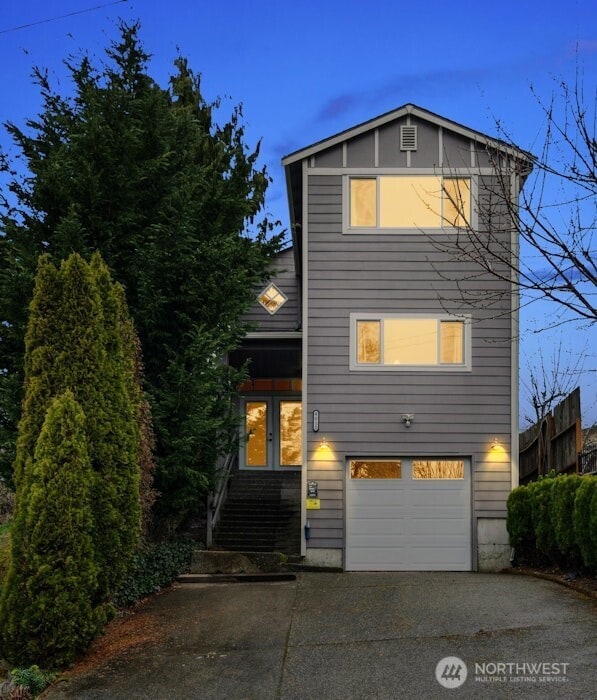 view of front facade featuring an attached garage and driveway