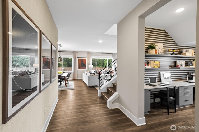 hallway with stairs, dark wood-style flooring, recessed lighting, and baseboards