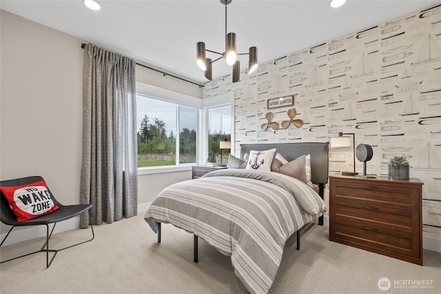 carpeted bedroom with a chandelier, recessed lighting, and baseboards