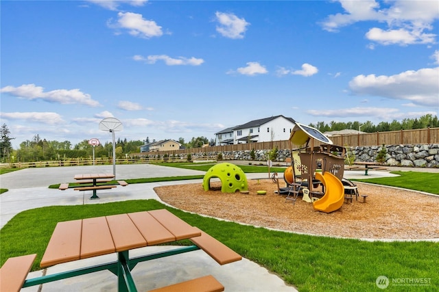 community play area with community basketball court and fence