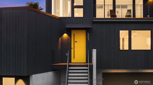 entrance to property with a balcony