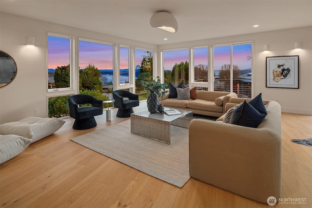 living area featuring wood finished floors and recessed lighting