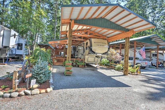 exterior space featuring a carport and driveway