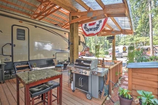 wooden deck featuring grilling area