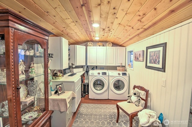 laundry area with washer and dryer, cabinet space, and wood ceiling