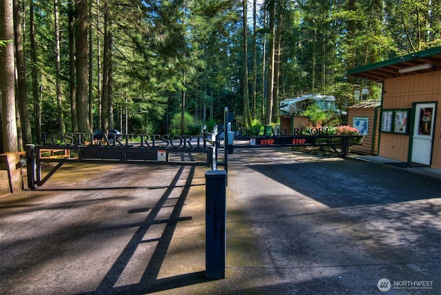 view of home's community with a gate