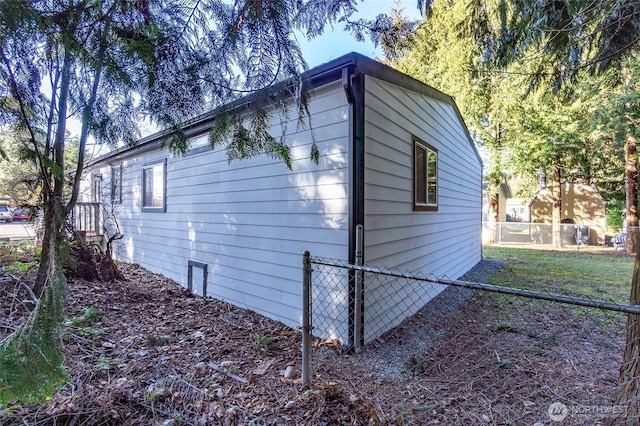 view of home's exterior featuring fence