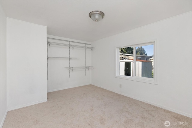 walk in closet featuring carpet