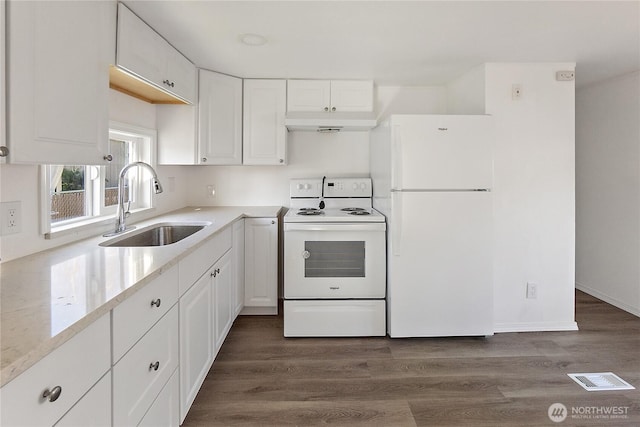 kitchen featuring visible vents, white cabinets, a sink, white appliances, and under cabinet range hood