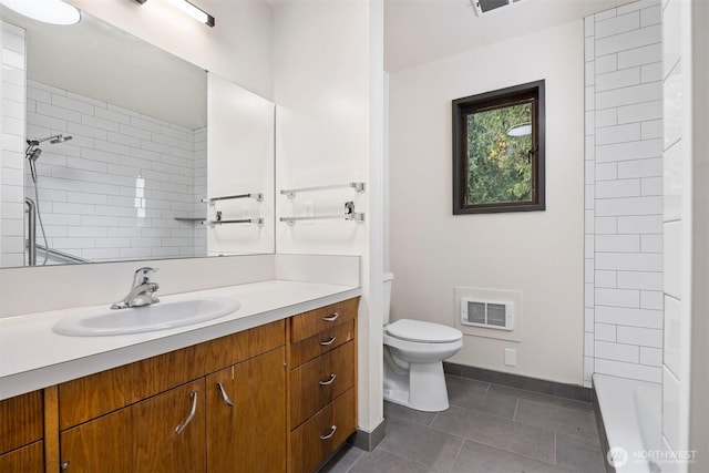 full bath with toilet, visible vents, vanity, a tile shower, and tile patterned floors