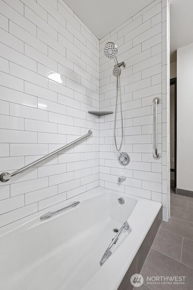 full bathroom with tile patterned flooring and tub / shower combination