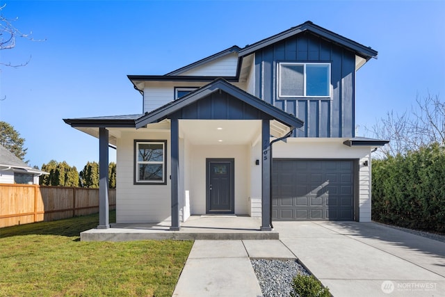 view of front of property with an attached garage, board and batten siding, fence, driveway, and a front lawn