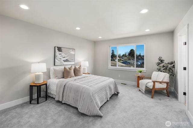 bedroom with light carpet, recessed lighting, visible vents, and baseboards