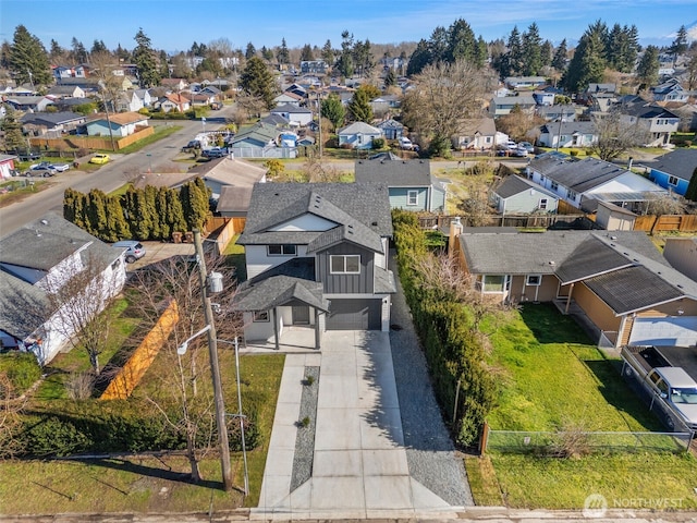 birds eye view of property with a residential view