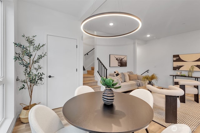 dining space with stairs, recessed lighting, and light wood-type flooring