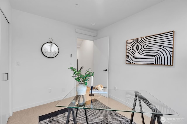 home office with baseboards and carpet floors