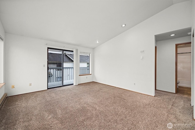 unfurnished room with lofted ceiling, carpet floors, and recessed lighting