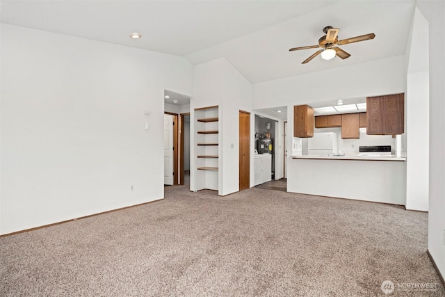 unfurnished living room featuring a ceiling fan, lofted ceiling, washing machine and clothes dryer, carpet, and recessed lighting