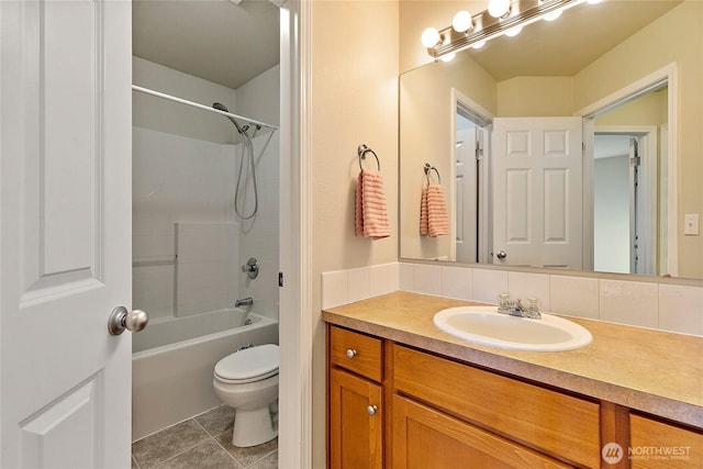 bathroom featuring shower / bathing tub combination, backsplash, toilet, vanity, and tile patterned floors