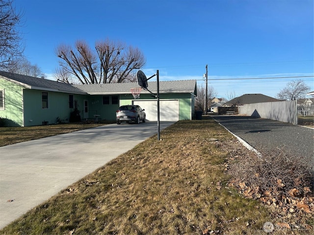 exterior space with concrete driveway and an attached garage