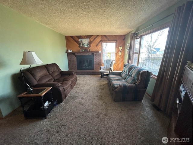 living area with carpet floors, a brick fireplace, wood walls, and a textured ceiling