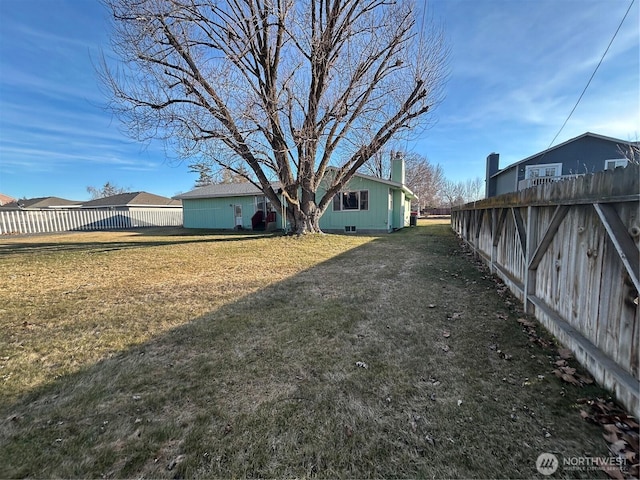 view of yard featuring a fenced backyard