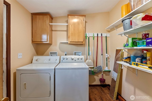 laundry room featuring dark wood-style floors, cabinet space, and independent washer and dryer