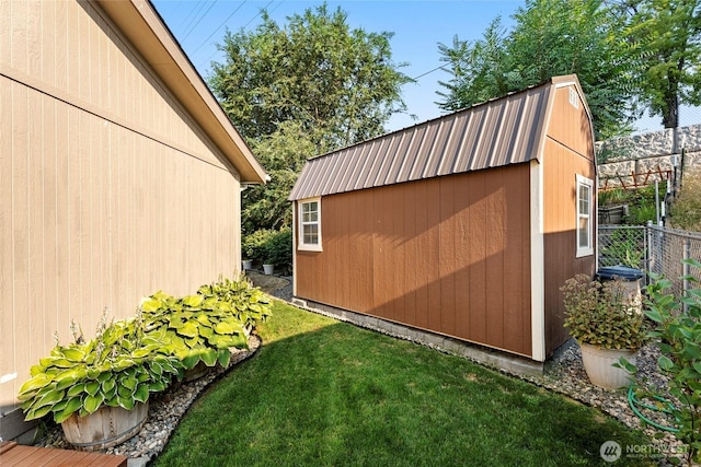 view of shed featuring fence