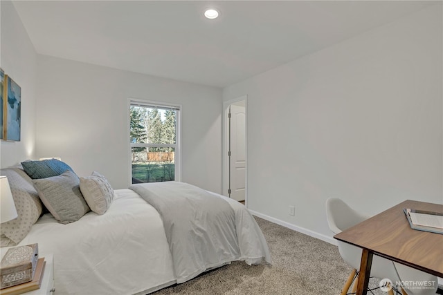 carpeted bedroom featuring baseboards and recessed lighting