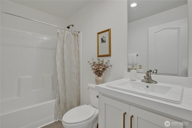 full bath featuring toilet, shower / tub combo, and vanity