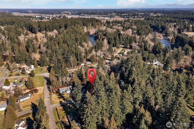 aerial view featuring a view of trees