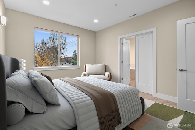 carpeted bedroom featuring baseboards, visible vents, and recessed lighting