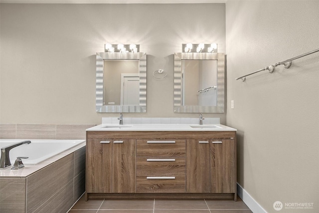 bathroom featuring double vanity, tile patterned flooring, and a sink