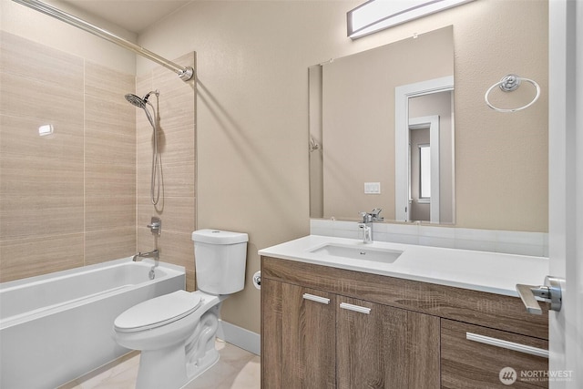 bathroom with bathtub / shower combination, baseboards, vanity, and toilet