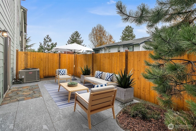 view of patio / terrace with an outdoor hangout area, a fenced backyard, and cooling unit