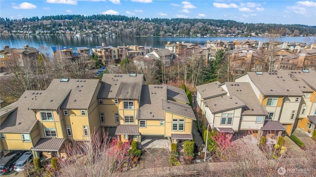 bird's eye view with a water view and a residential view