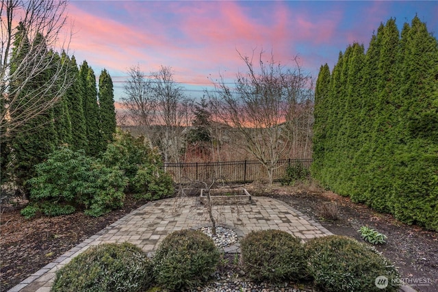 view of patio featuring fence