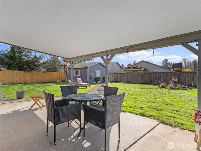 view of patio / terrace with outdoor dining space and a fenced backyard