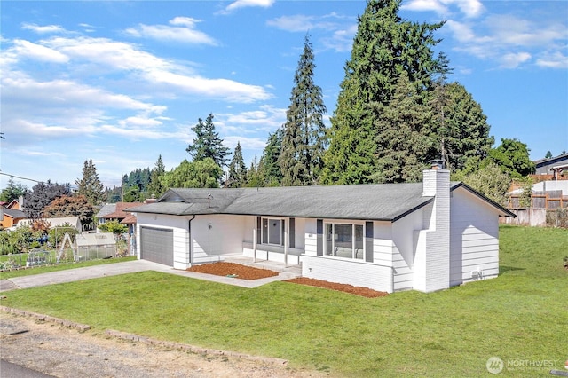 ranch-style home with an attached garage, fence, driveway, a front lawn, and a chimney