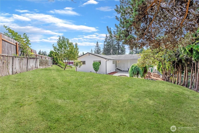 view of yard featuring a fenced backyard and a patio