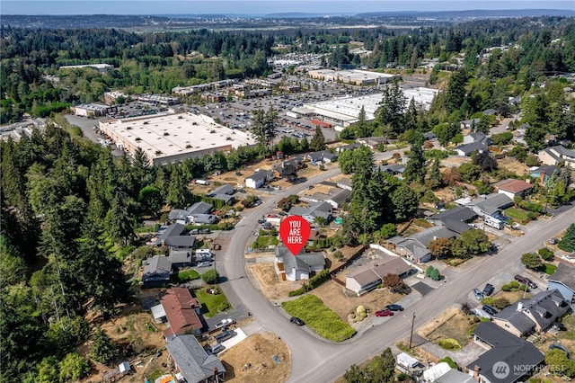 aerial view with a wooded view