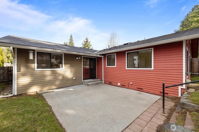 view of front facade featuring crawl space, fence, and a patio