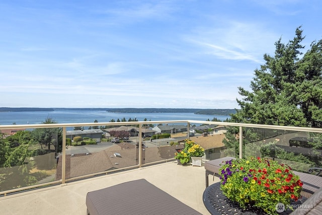 balcony featuring a water view