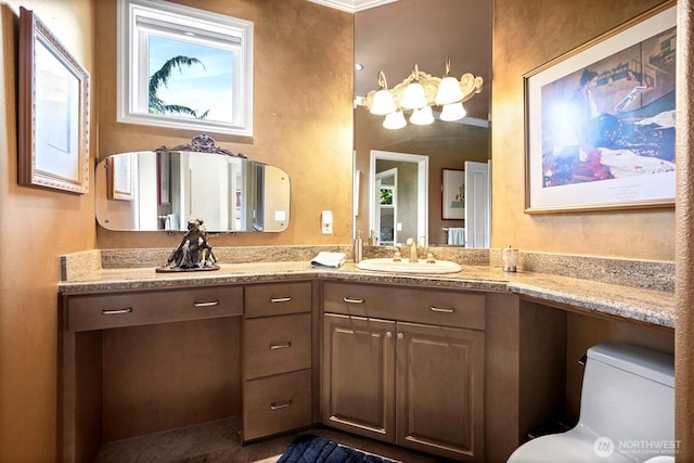 bathroom with toilet and vanity