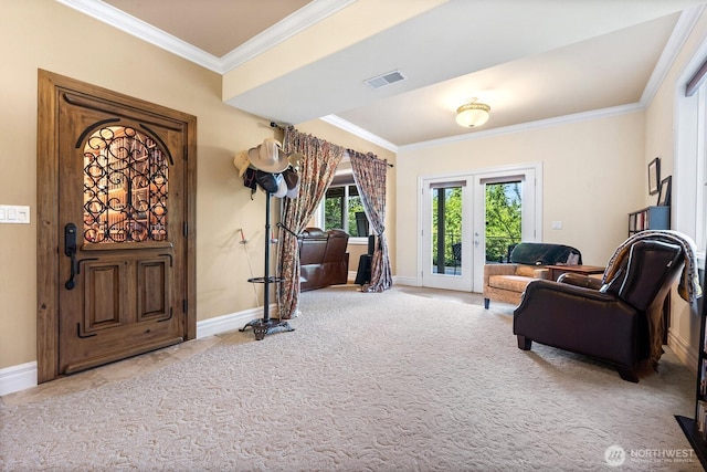 sitting room with baseboards, visible vents, carpet flooring, and ornamental molding