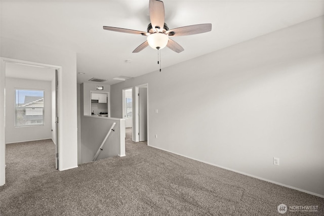 unfurnished living room featuring visible vents, ceiling fan, baseboards, and carpet floors