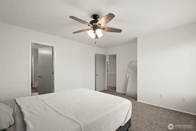 carpeted bedroom with baseboards and a ceiling fan