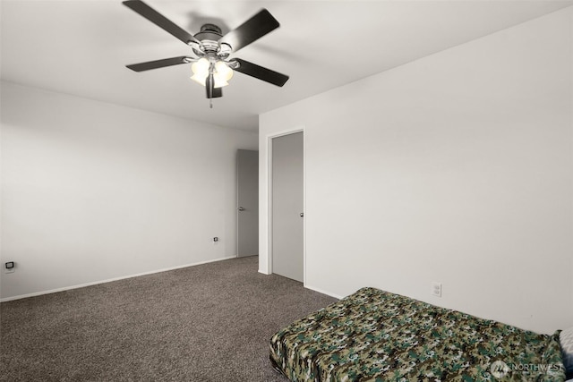 unfurnished bedroom with ceiling fan, baseboards, and carpet